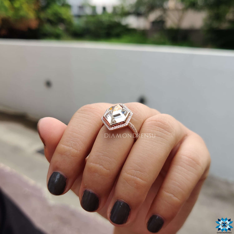Handmade rose gold engagement ring with hexagon cut stone.
