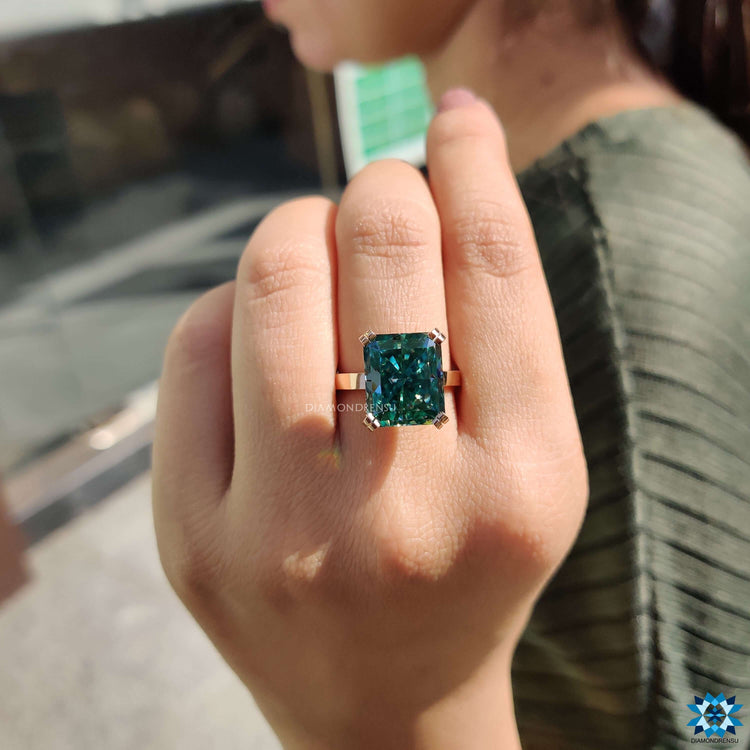 Rose gold radiant cut ring with hidden halo design.
