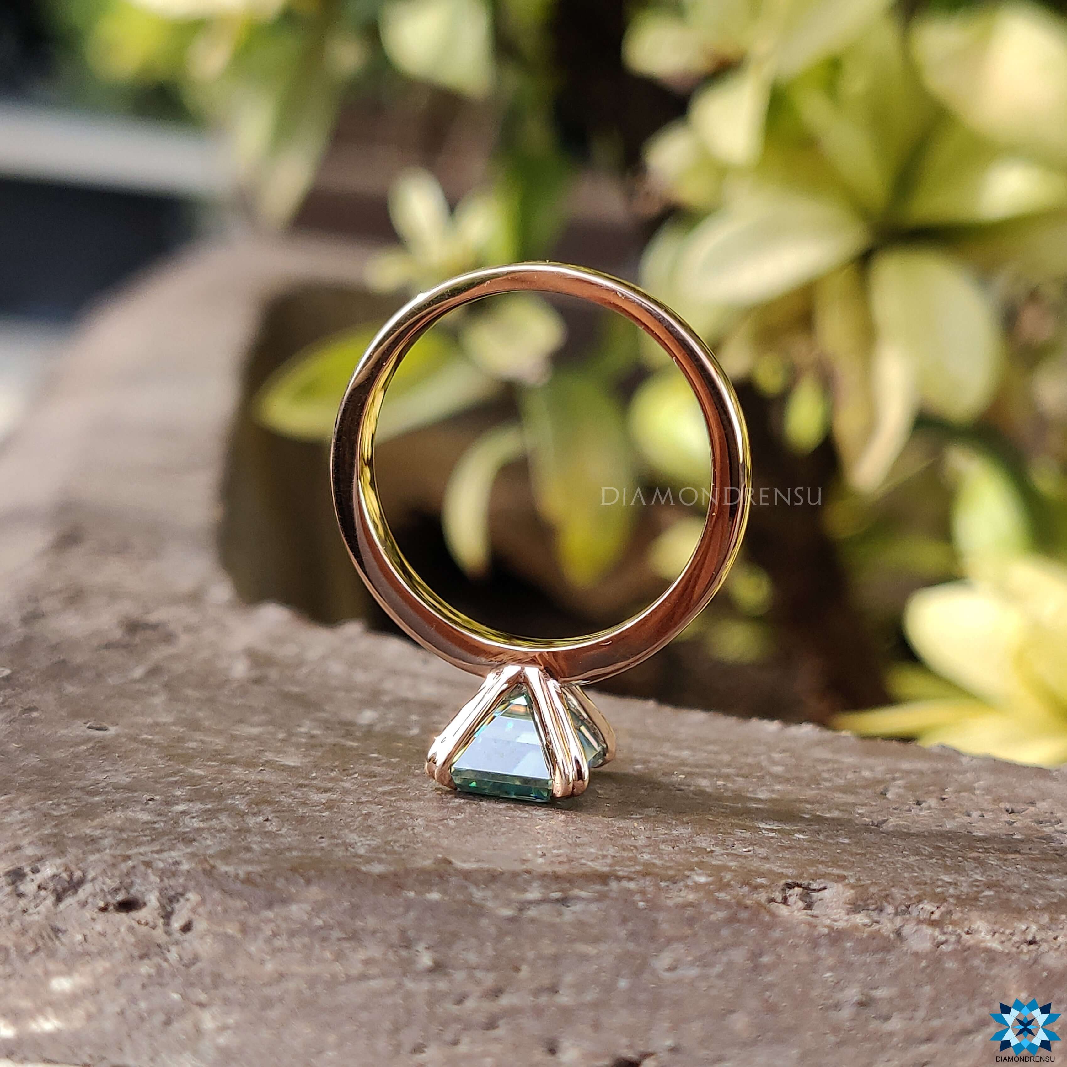 Solitaire ring featuring an emerald cut moissanite centre stone for maximum brilliance.