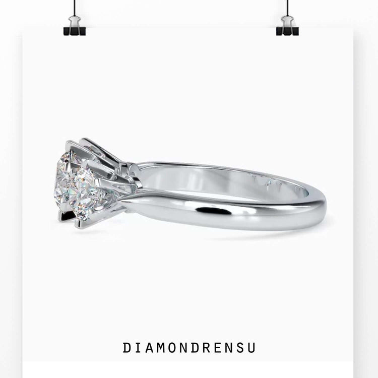 UK engagement ring with lab grown round cut diamond trio.
