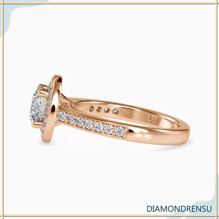 Designer ring with round brilliant diamond in halo setting.
