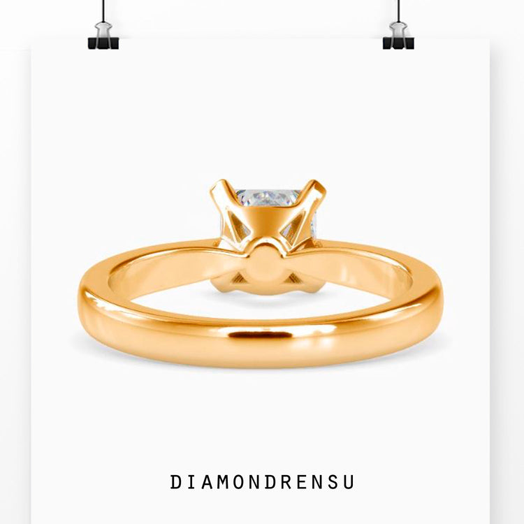 UK engagement ring with princess cut solitaire and tapered band.
