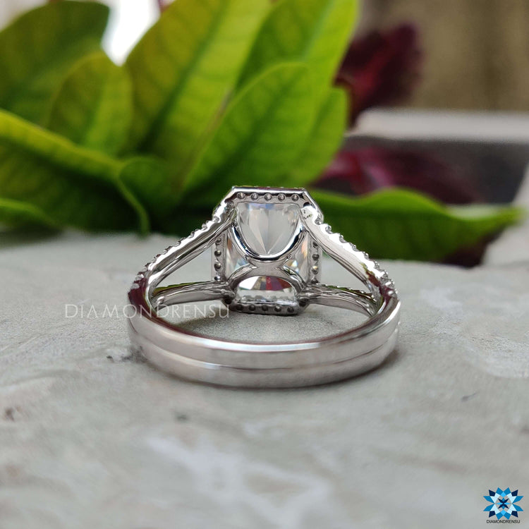 White gold halo engagement ring with radiant center.
