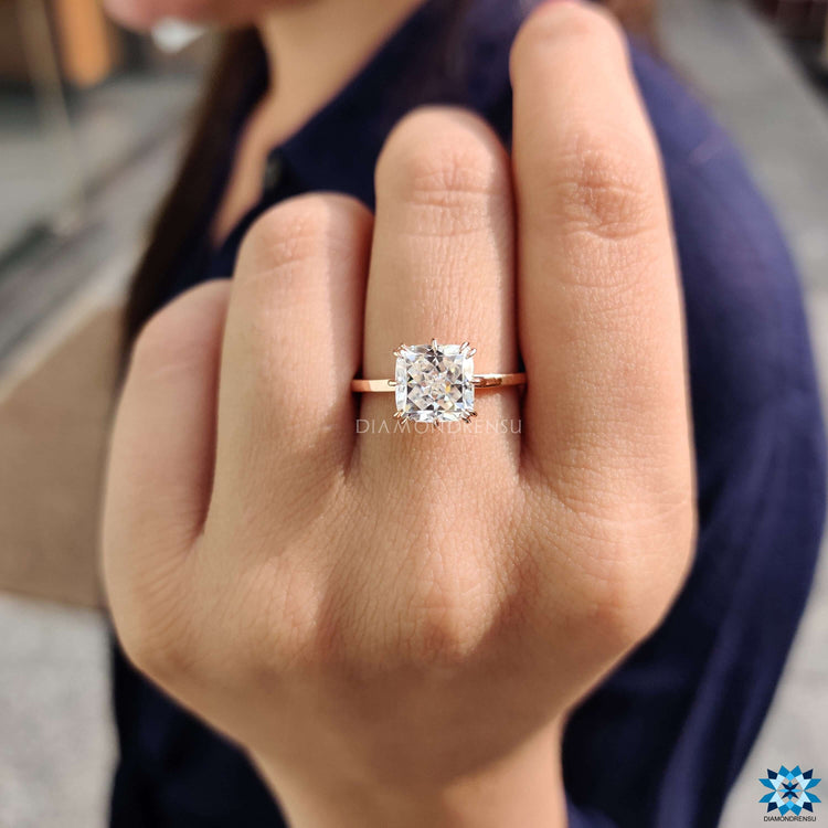 Buy moissanite ring with compass-style prong setting.
