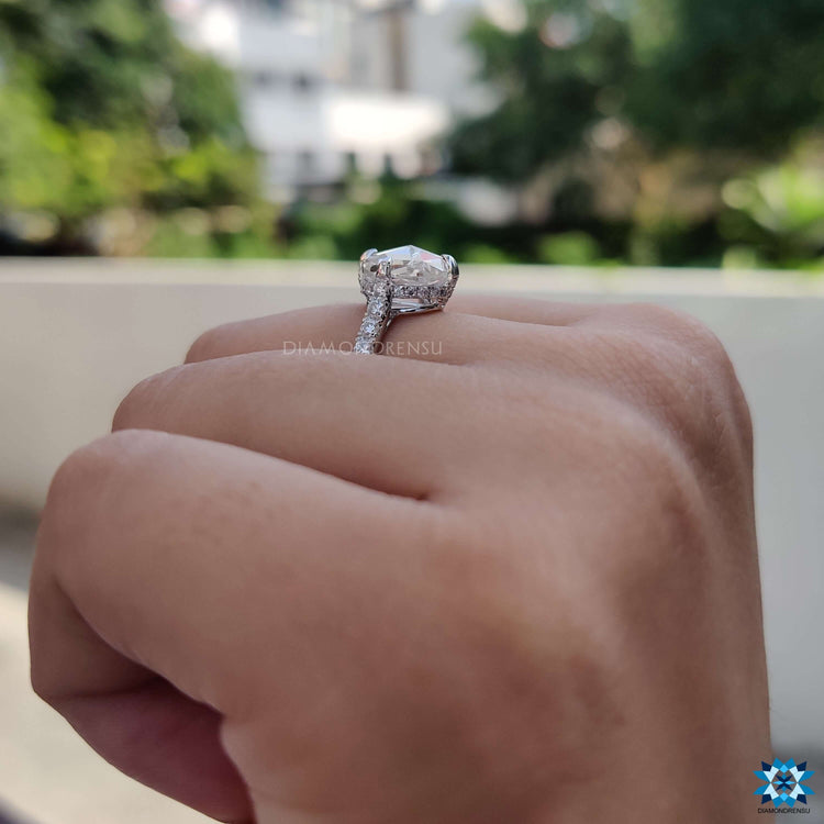 Four claw prong rose moissanite ring in white gold.
