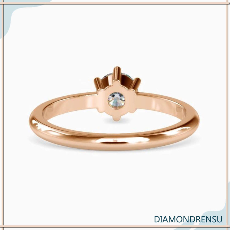 Diamondrensu UK engagement ring with round diamond in six prongs.
