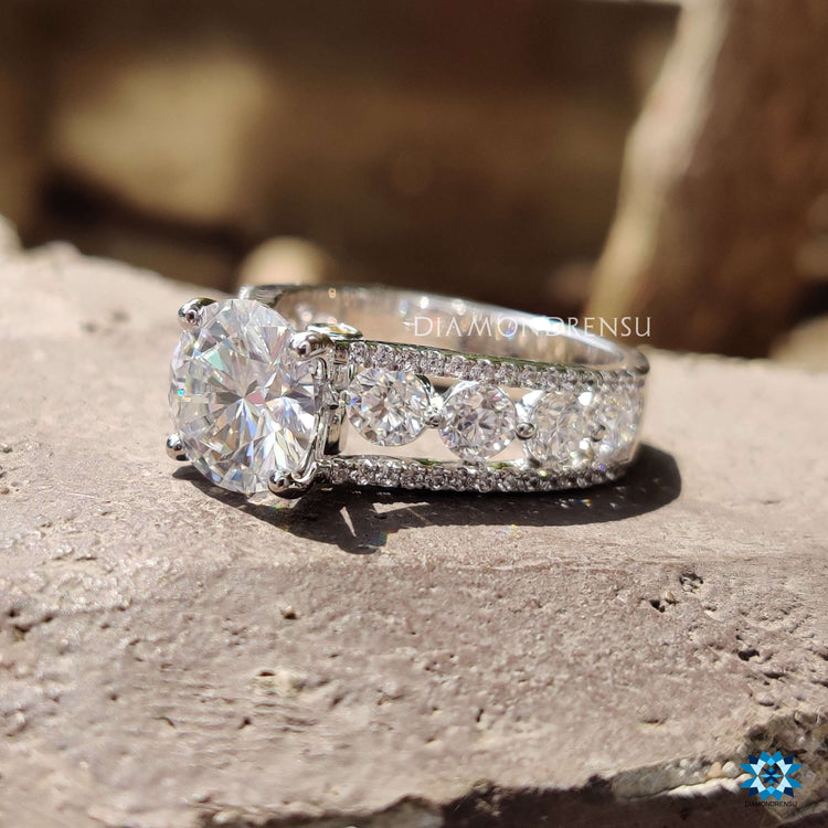 Moissanite engagement ring with four prong center setting.

