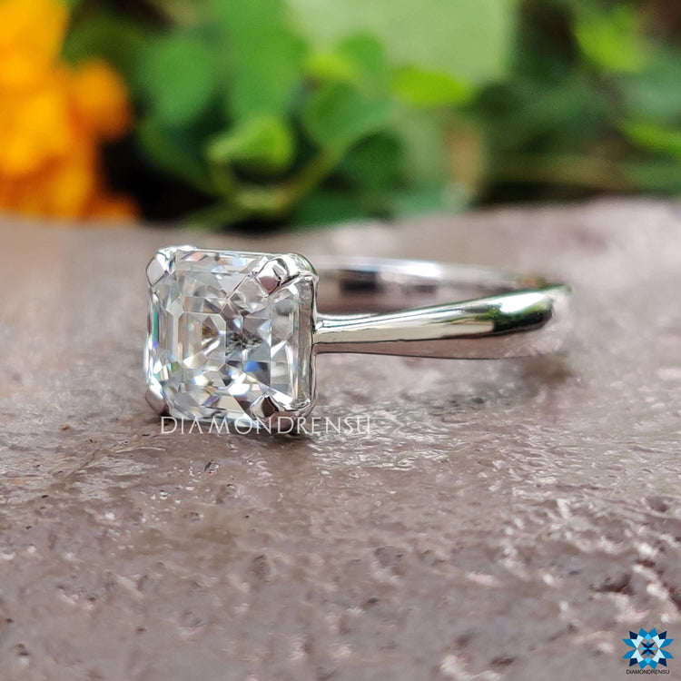 White gold tapered band engagement ring with octavia cut.
