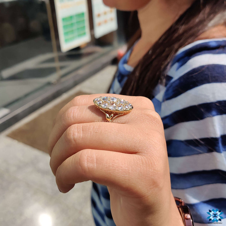 Prong set yellow gold ring with moissanite.

