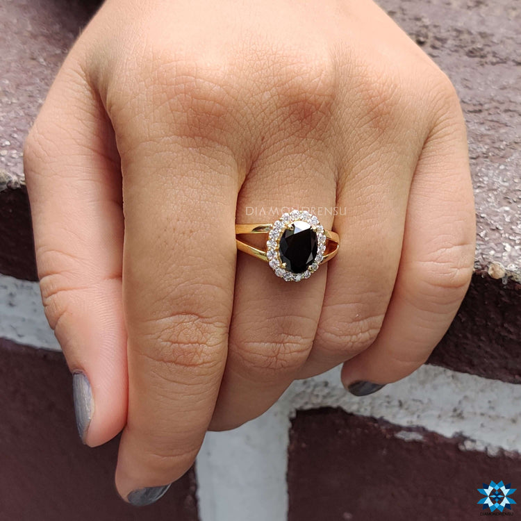 Diamondrensu UK yellow gold black moissanite ring.
