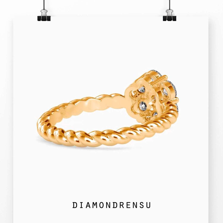 Yellow gold engagement ring with round diamond cluster and halo design.
