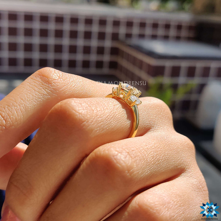 Cushion moissanite center stone with half moon accents.

