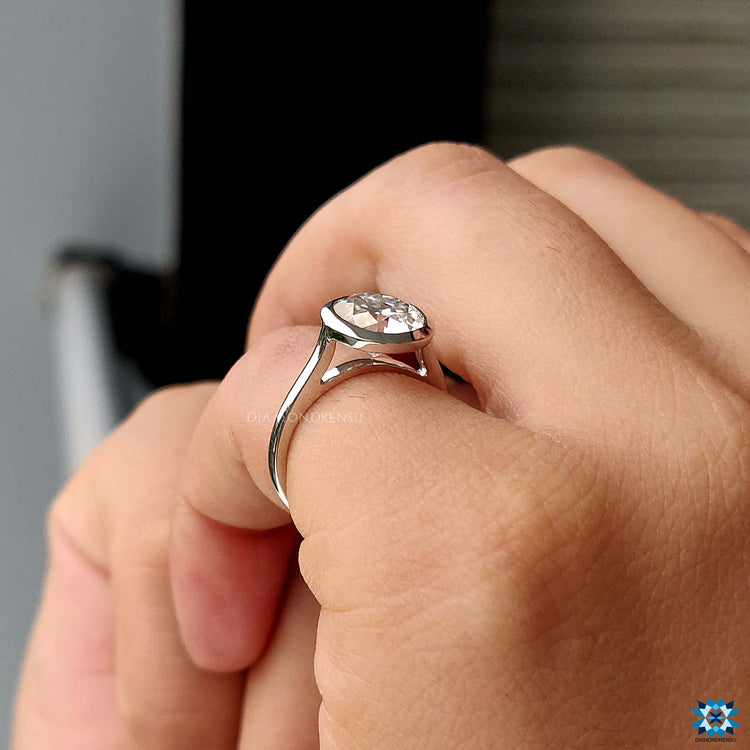 UK engagement ring with bezel setting design.
