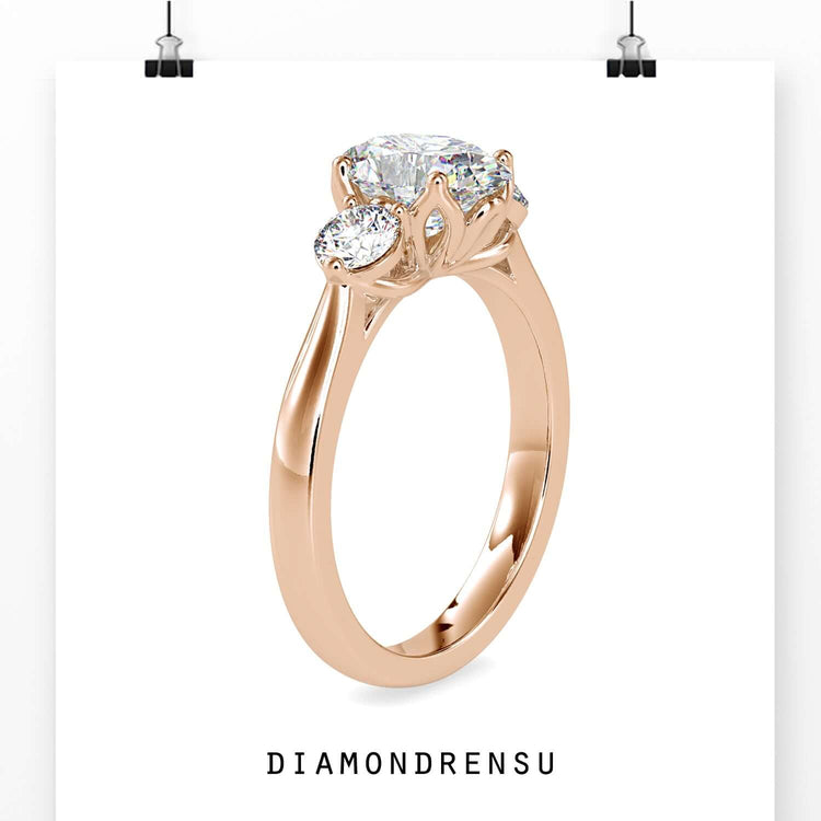 UK diamond ring with oval and round stones.
