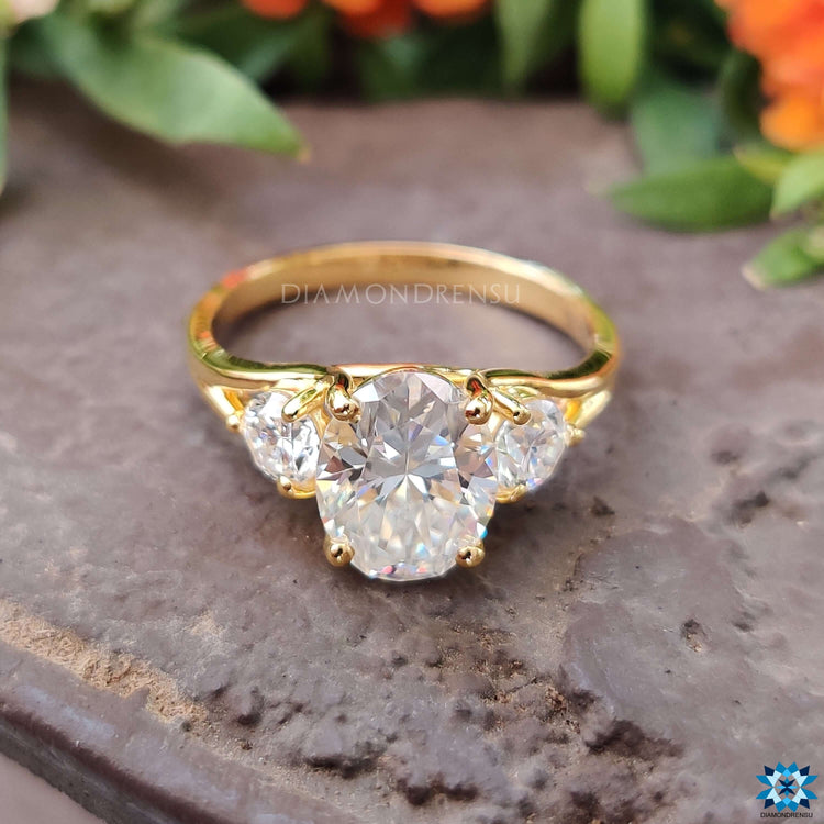 Custom engagement ring with oval center and round accents.
