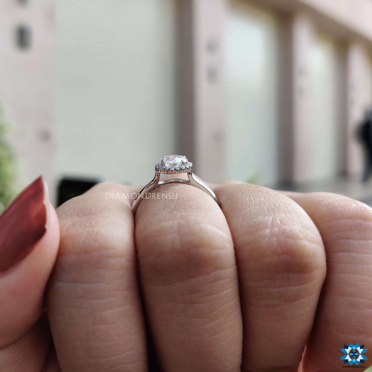 Cathedral setting ring with moissanite halo design.
