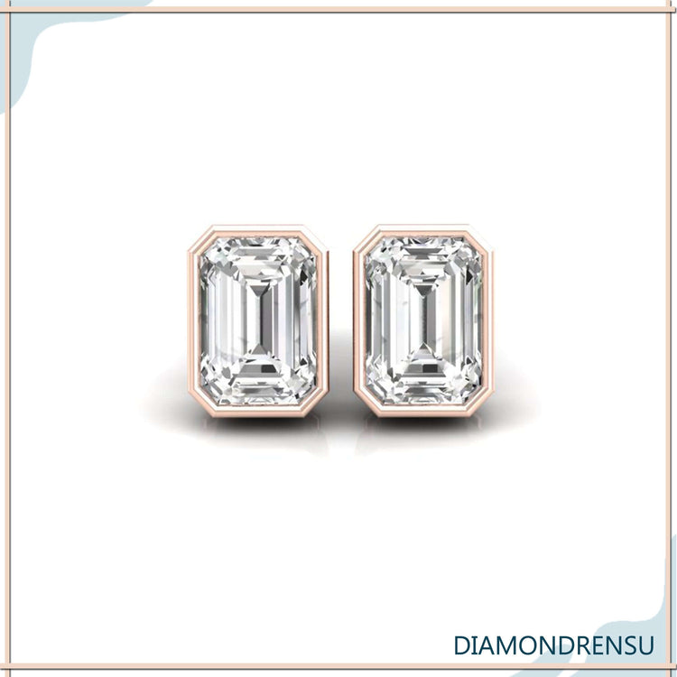Rose gold stud earrings featuring emerald cut diamonds.

