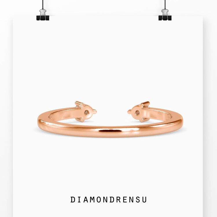 Simple white gold open gap wedding band with diamonds.
