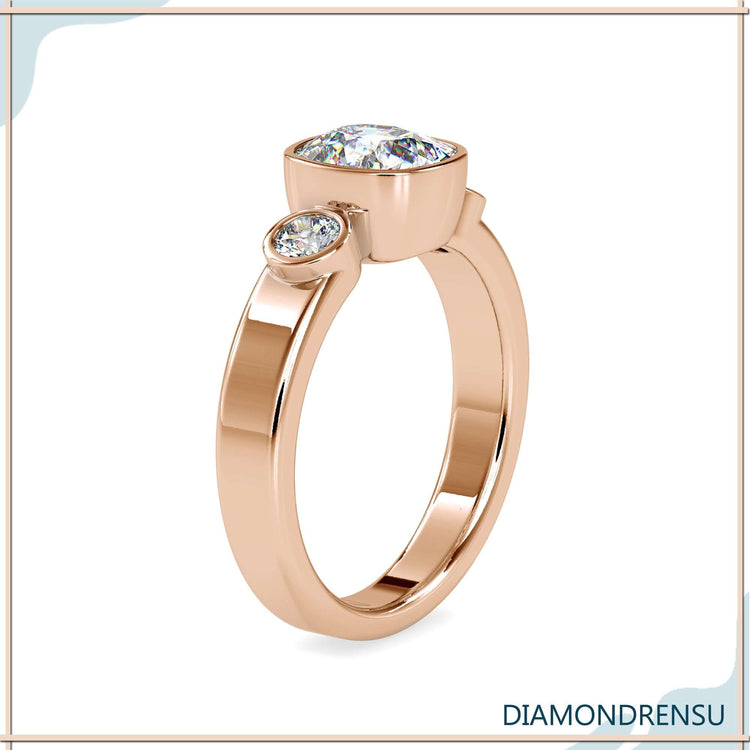 Rose gold engagement ring featuring round and cushion diamonds.
