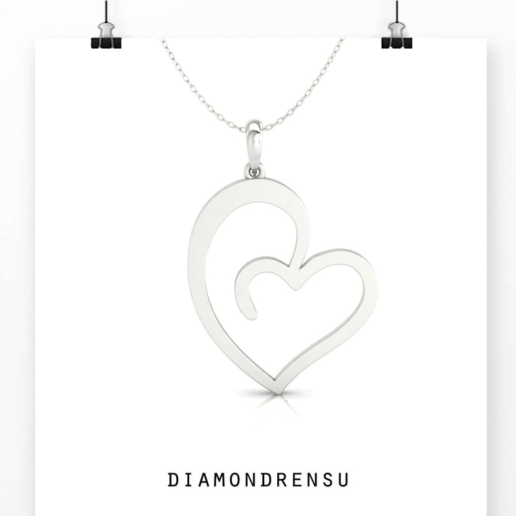 Handmade heart with diamond pendant in classic white gold.
