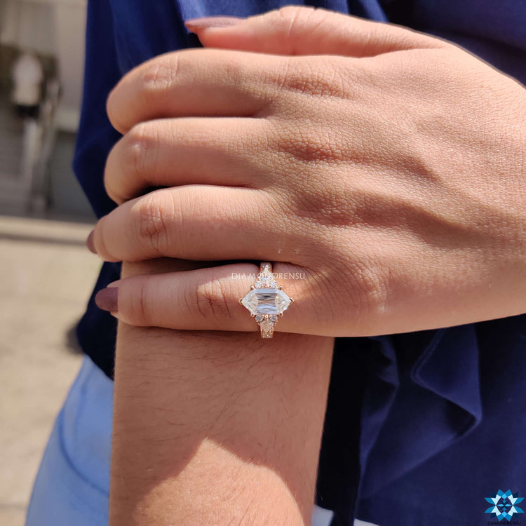 Hexagon Criss engagement ring with kite and round cut side stones.
