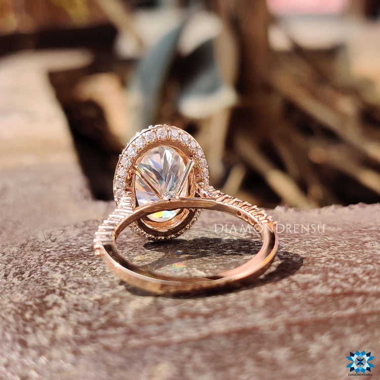 Four prong setting rose gold moissanite ring.
