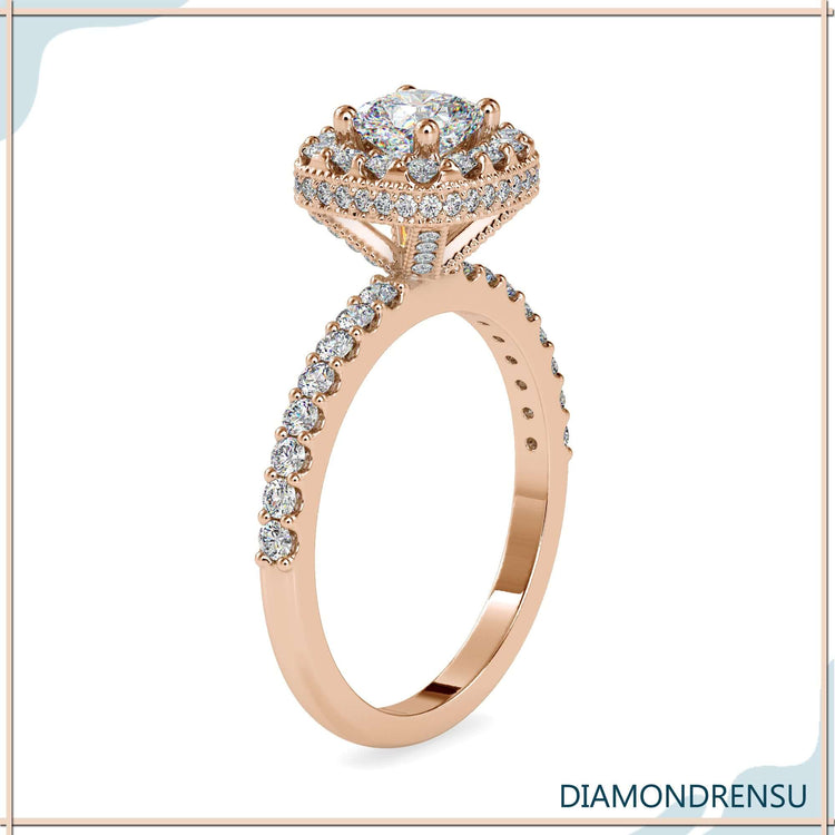 Hidden halo ring with cushion diamond centre and side stones.
