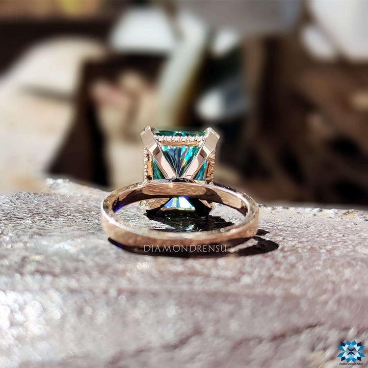 Prong set radiant cut moissanite ring in rose gold.
