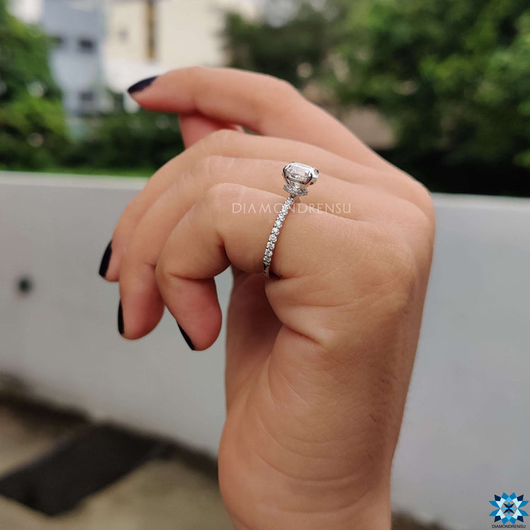4 prong claw moissanite ring in white gold.
