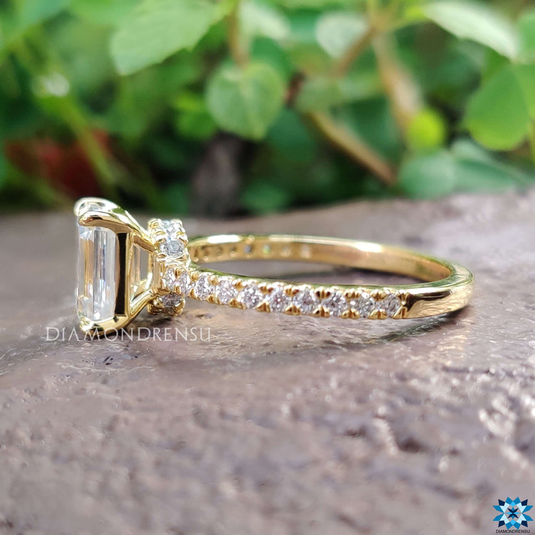 Custom engagement ring featuring emerald moissanite.
