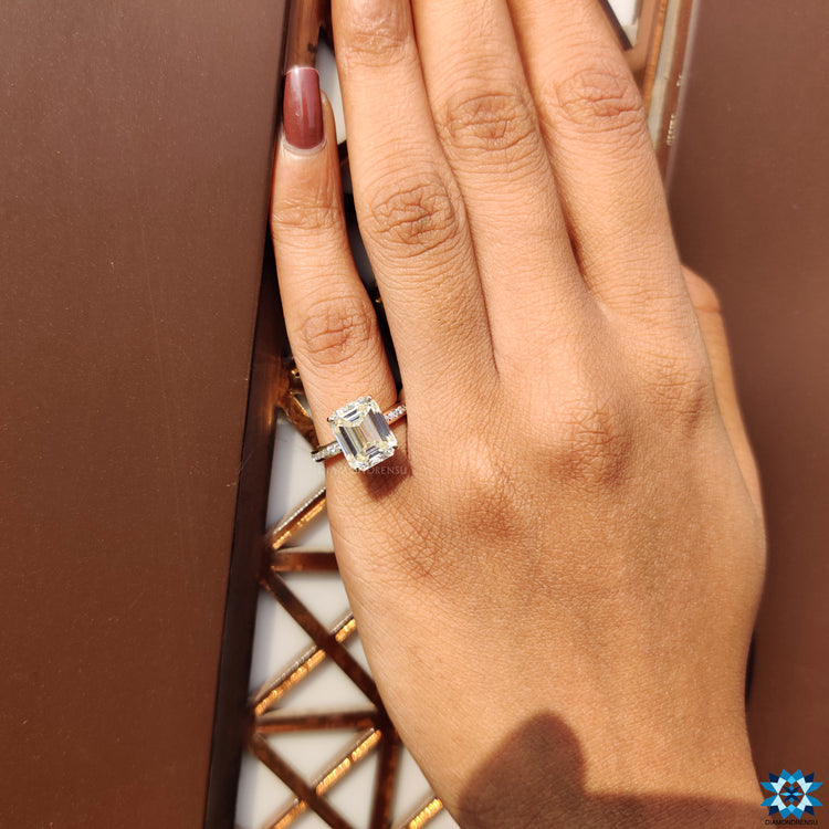 Pave setting ring in yellow gold with hidden halo and claw prongs.
