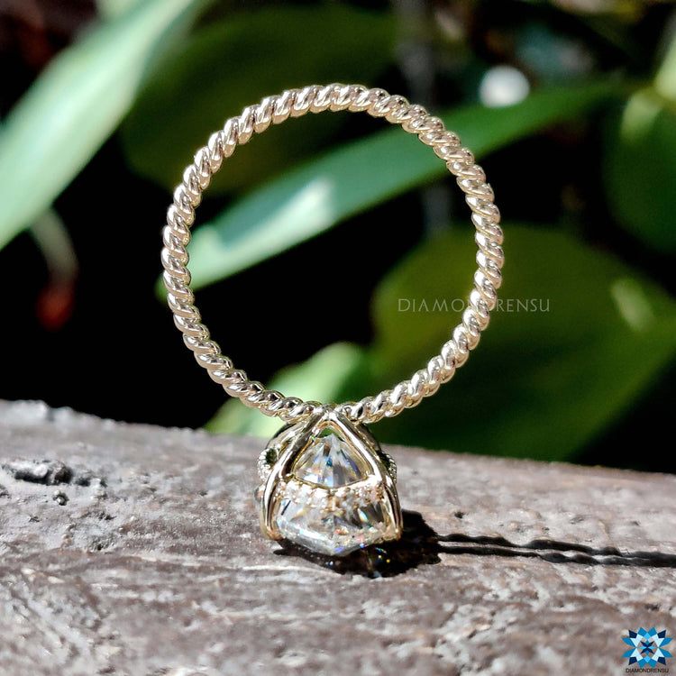 Custom marquise cut moissanite ring in yellow gold.
