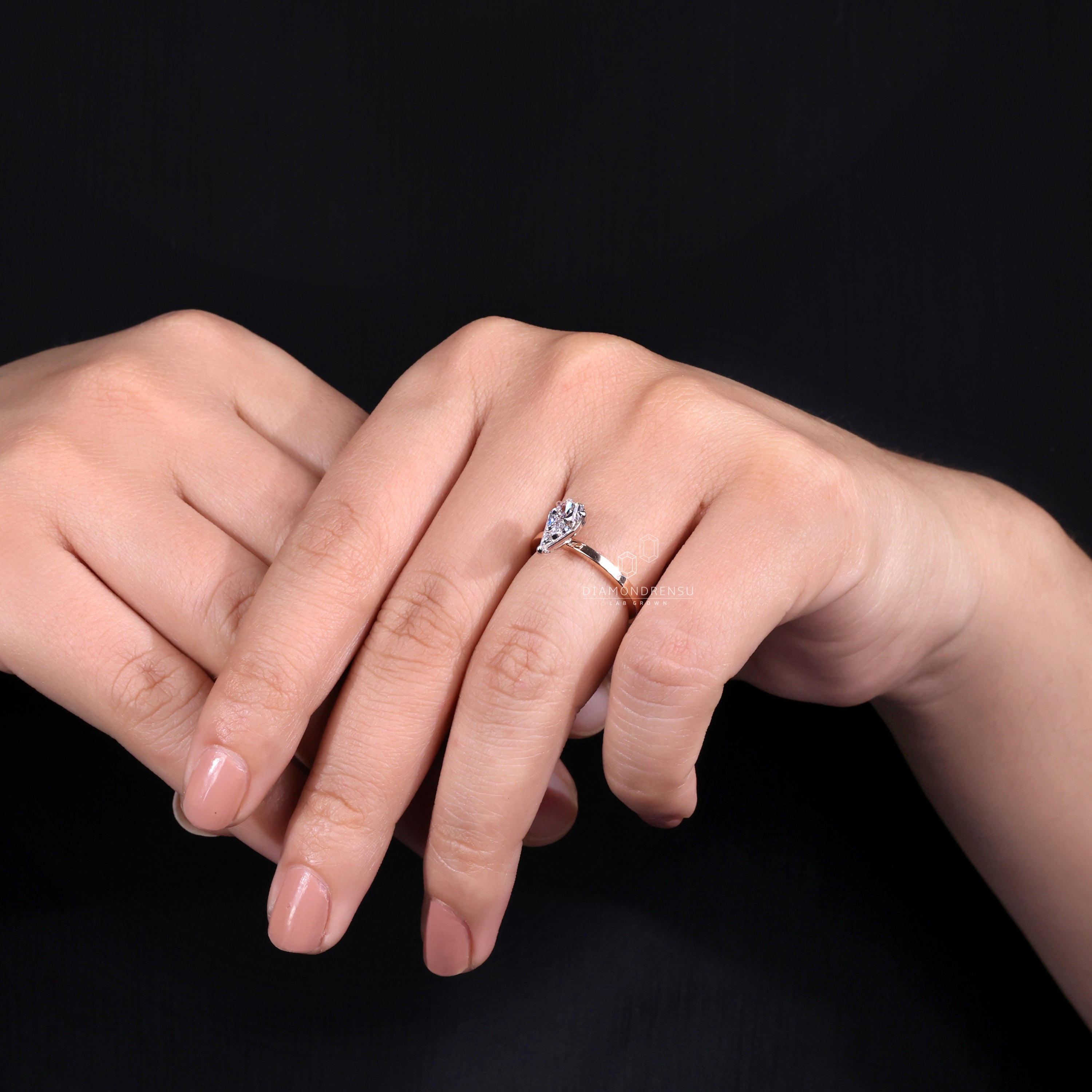 Spear cut diamond ring set in a handcrafted white gold band
