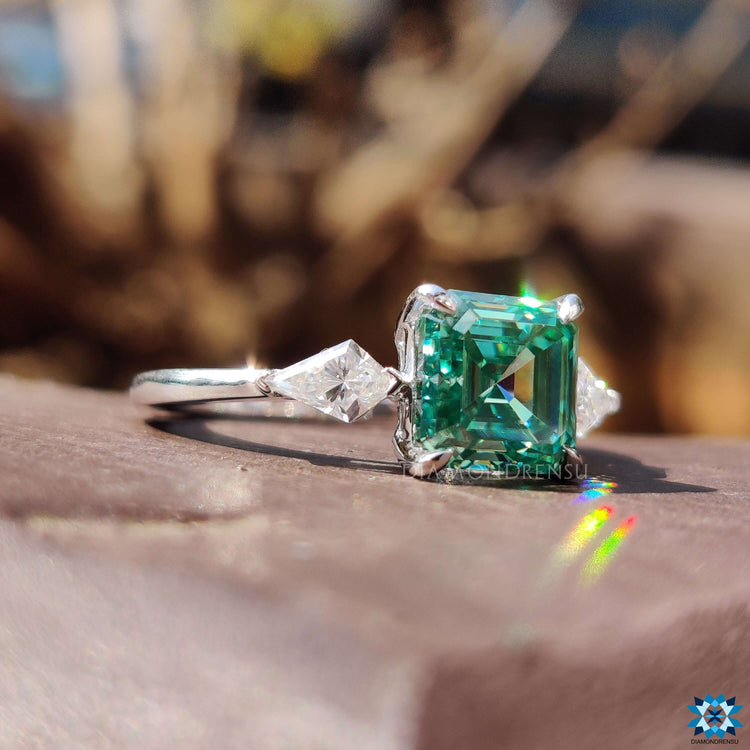 Kite cut ring with moissanite side stones.
