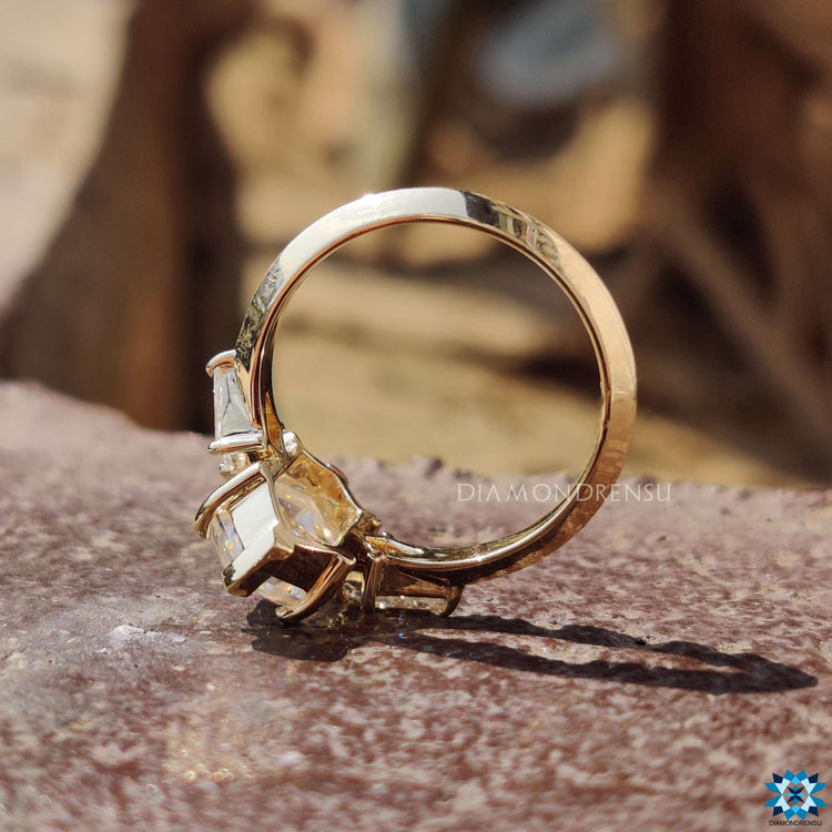 Hexagon rose cut moissanite in yellow gold setting.
