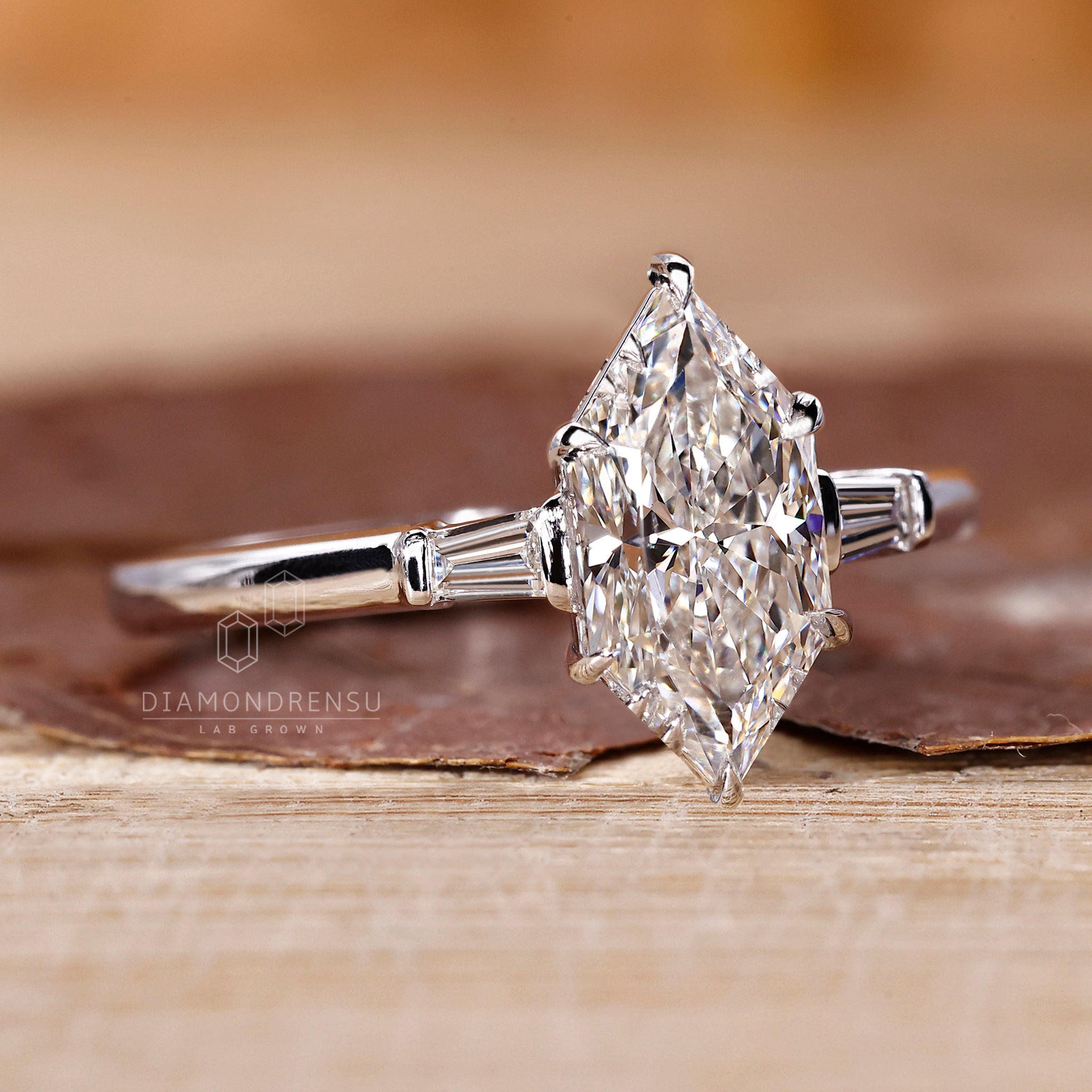 White gold engagement ring with claw prong setting.
