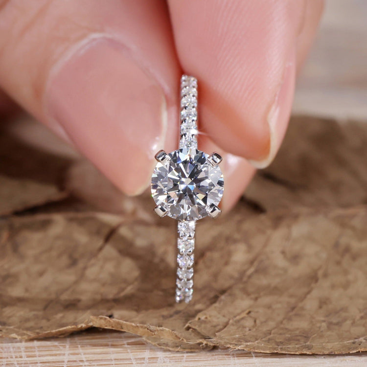 Handmade pave diamond ring with intricate design details.