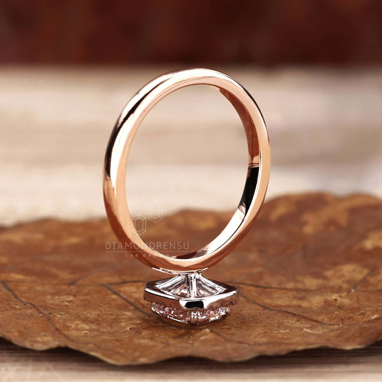 Handmade ring featuring a radiant cut engagement ring with a claw prong setting for added security.
