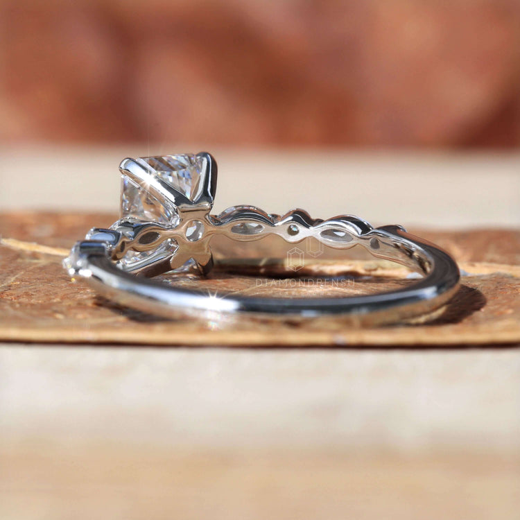 Radiant diamond ring with a marquise and round ring design, crafted for elegance and lasting beauty.
