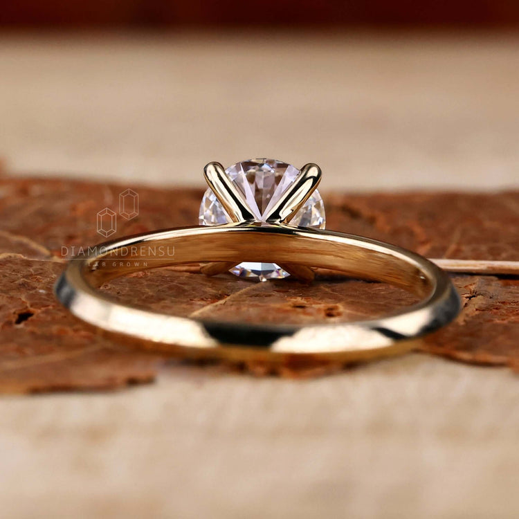 Solitaire diamond ring with a round cut diamond in a knife edge setting, crafted as a UK engagement ring.
