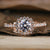 Halo engagement ring with intricate detailing for a classic look.