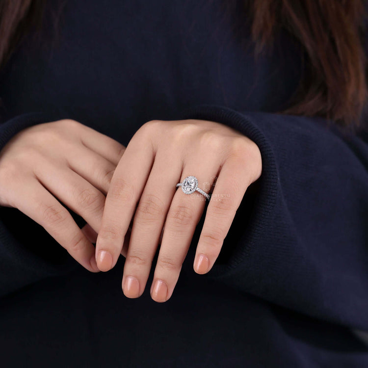 Oval diamond engagement ring featuring a stunning cathedral setting.
