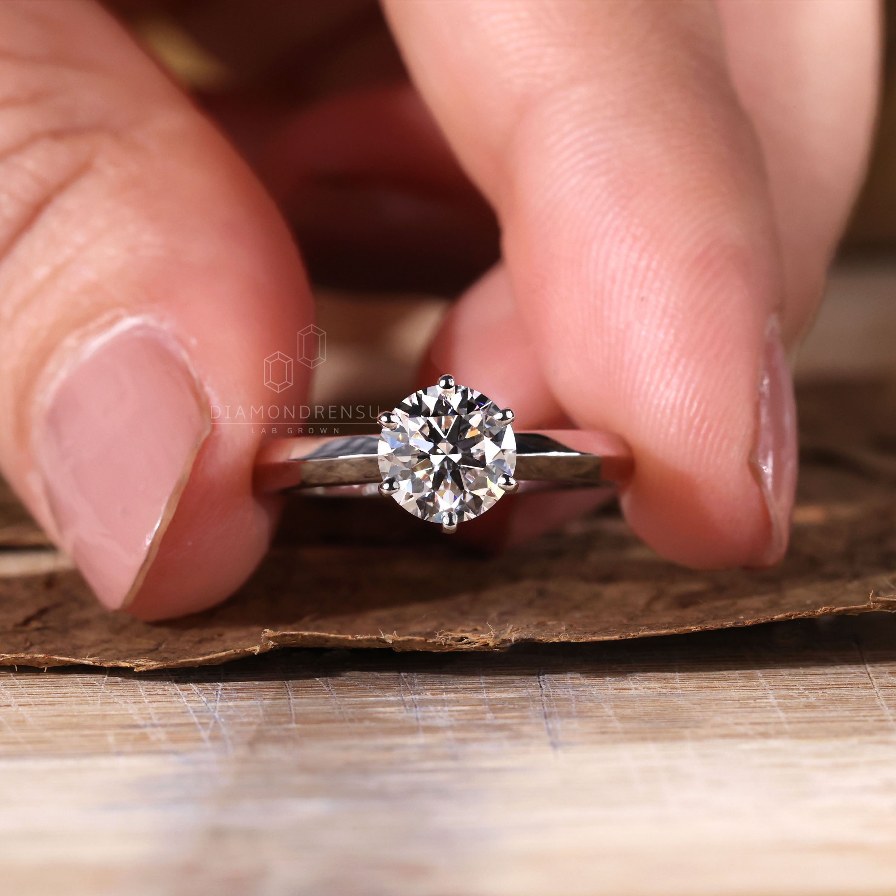 Round solitaire engagement ring showcasing a radiant centre stone.