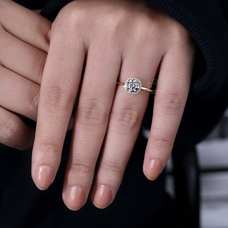 Round brilliant cut diamond ring featuring timeless elegance for women.
