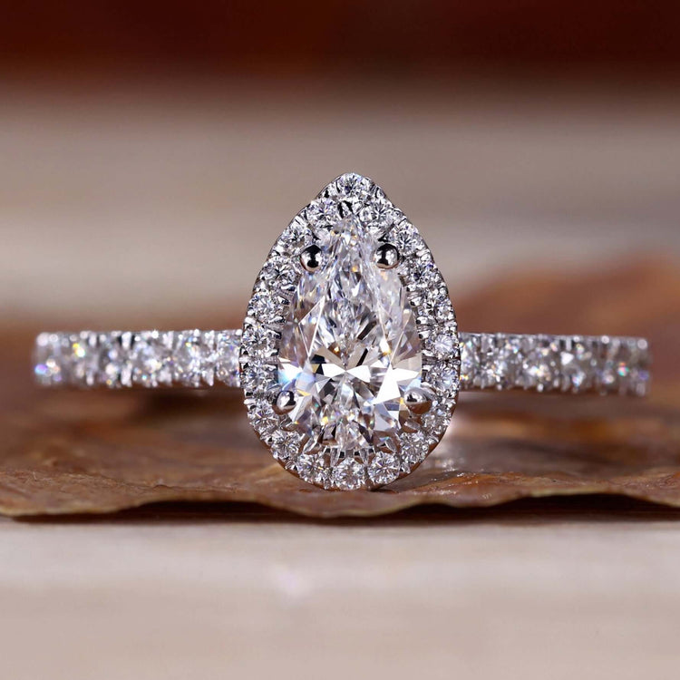 Pear Halo Engagement Ring with a stunning halo ring setting for a timeless and elegant style.

