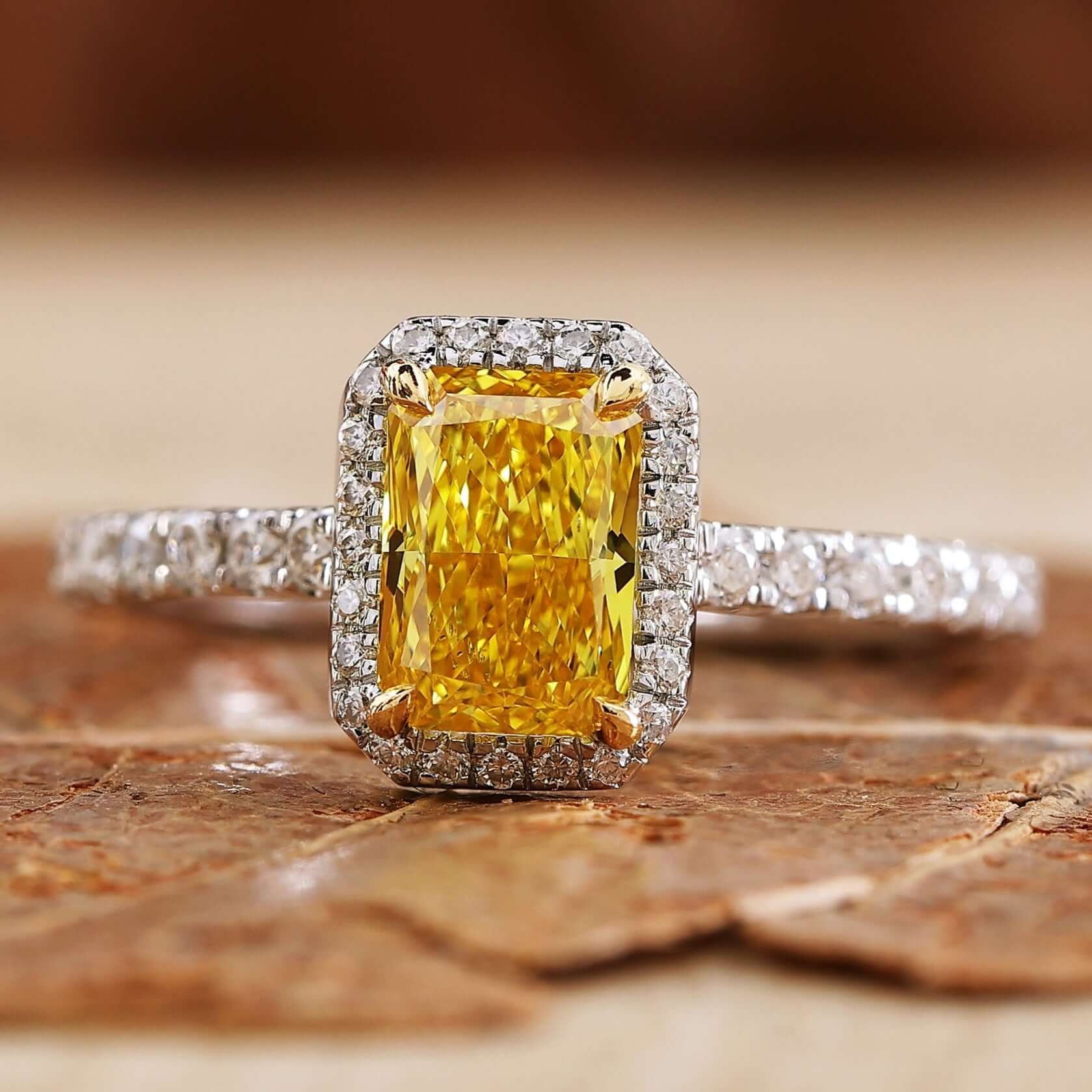 Yellow diamond ring featuring a radiant design and sparkling accents.