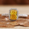 Yellow diamond ring featuring a radiant design and sparkling accents.