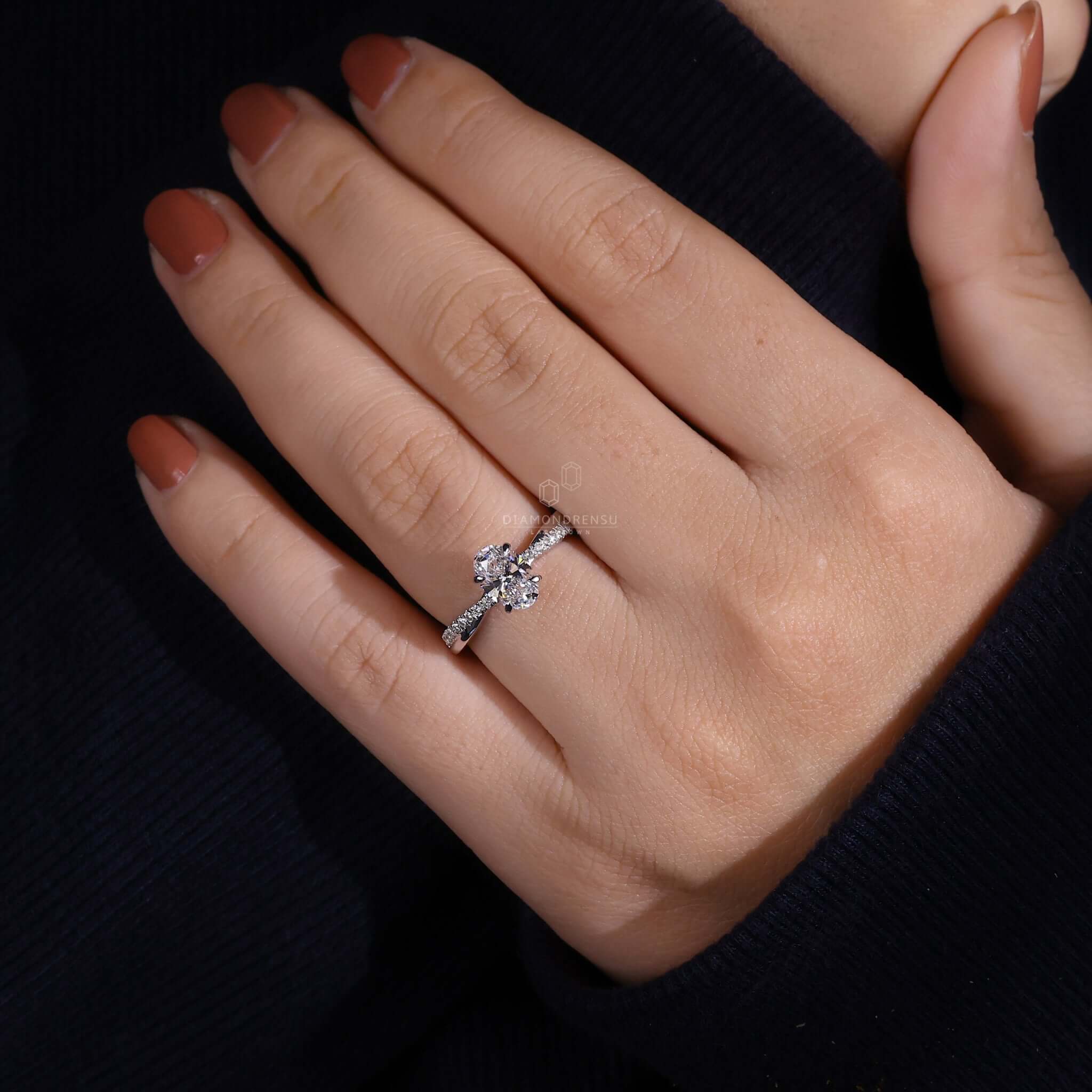 Unique engagement ring featuring an oval engagement ring design with a twisted band and handmade ring craftsmanship.