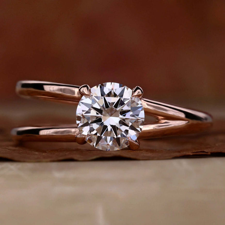 Split shank engagement ring with brilliant cut diamond in UK style design.
