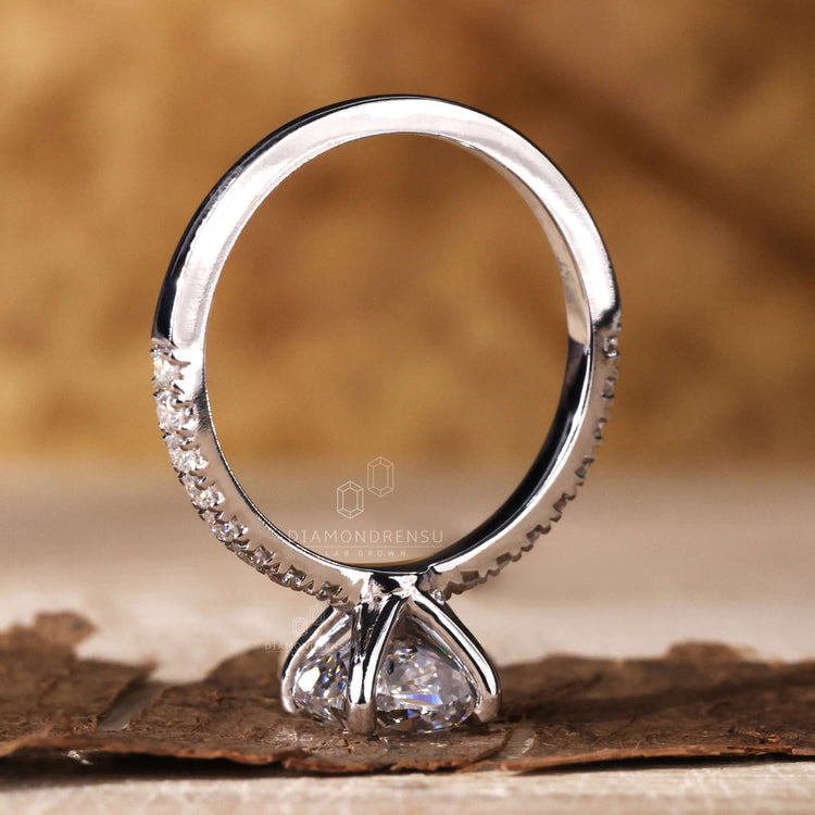 Cushion ring cut with pave set diamonds, ideal for anyone seeking a UK engagement ring with modern elegance.
